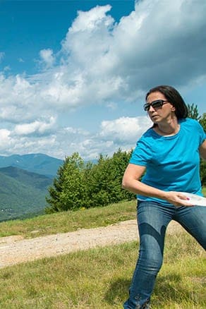 picture of woman playing disc golf at Loon Mountain Resort, NH
