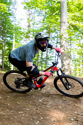 riding bike on wooded trail